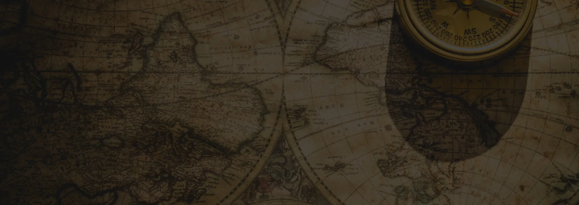 Antique world map with a brass compass
